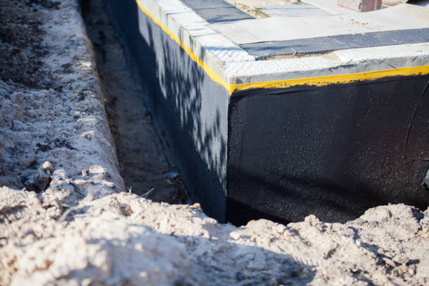 Professional Basement Waterproofing technician working in Junction City, WI